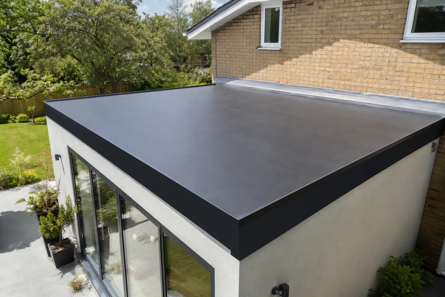 Newly installed EPDM rubber flat roof on a single-storey extension